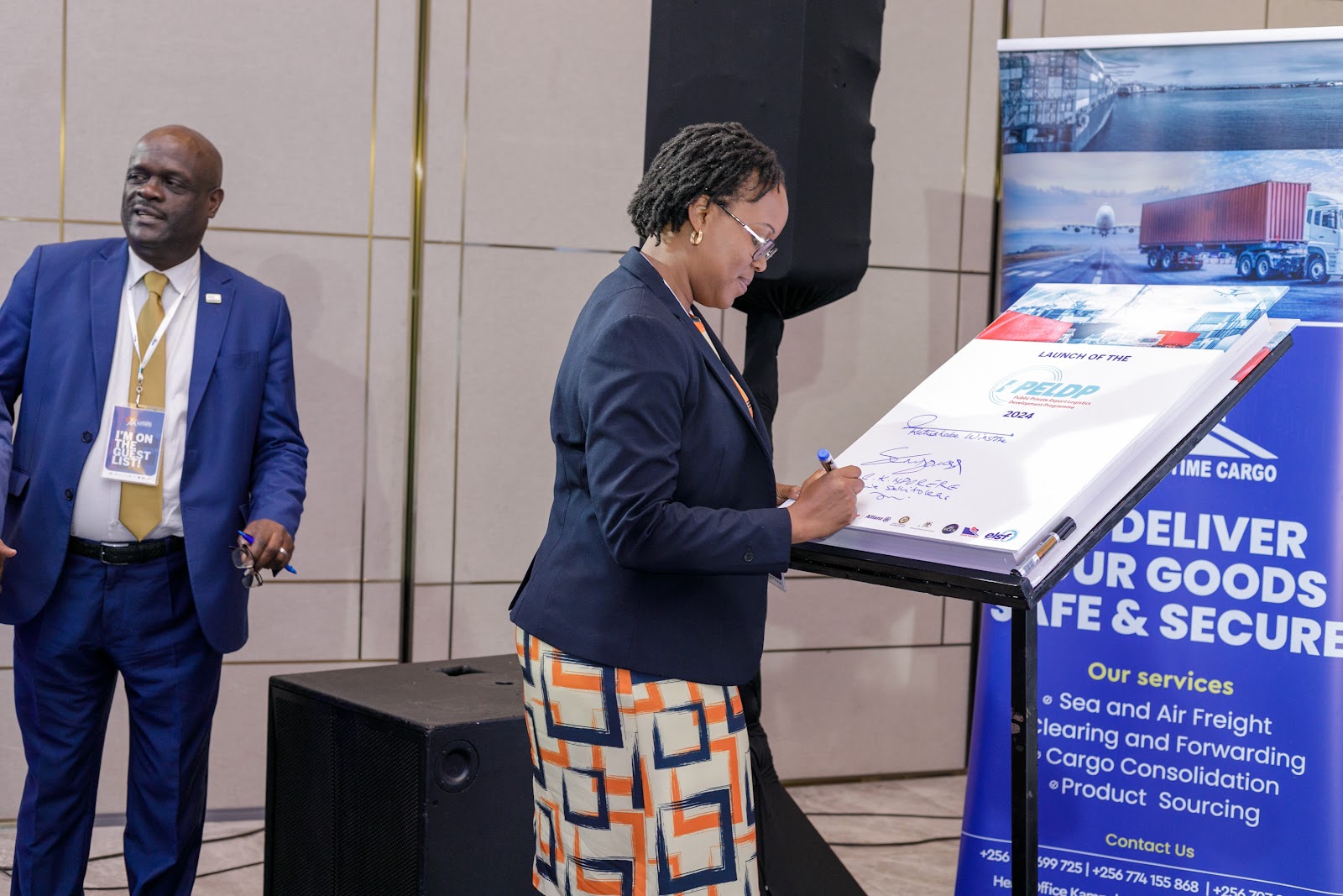 A stakeholder signing the PPELD commitment board