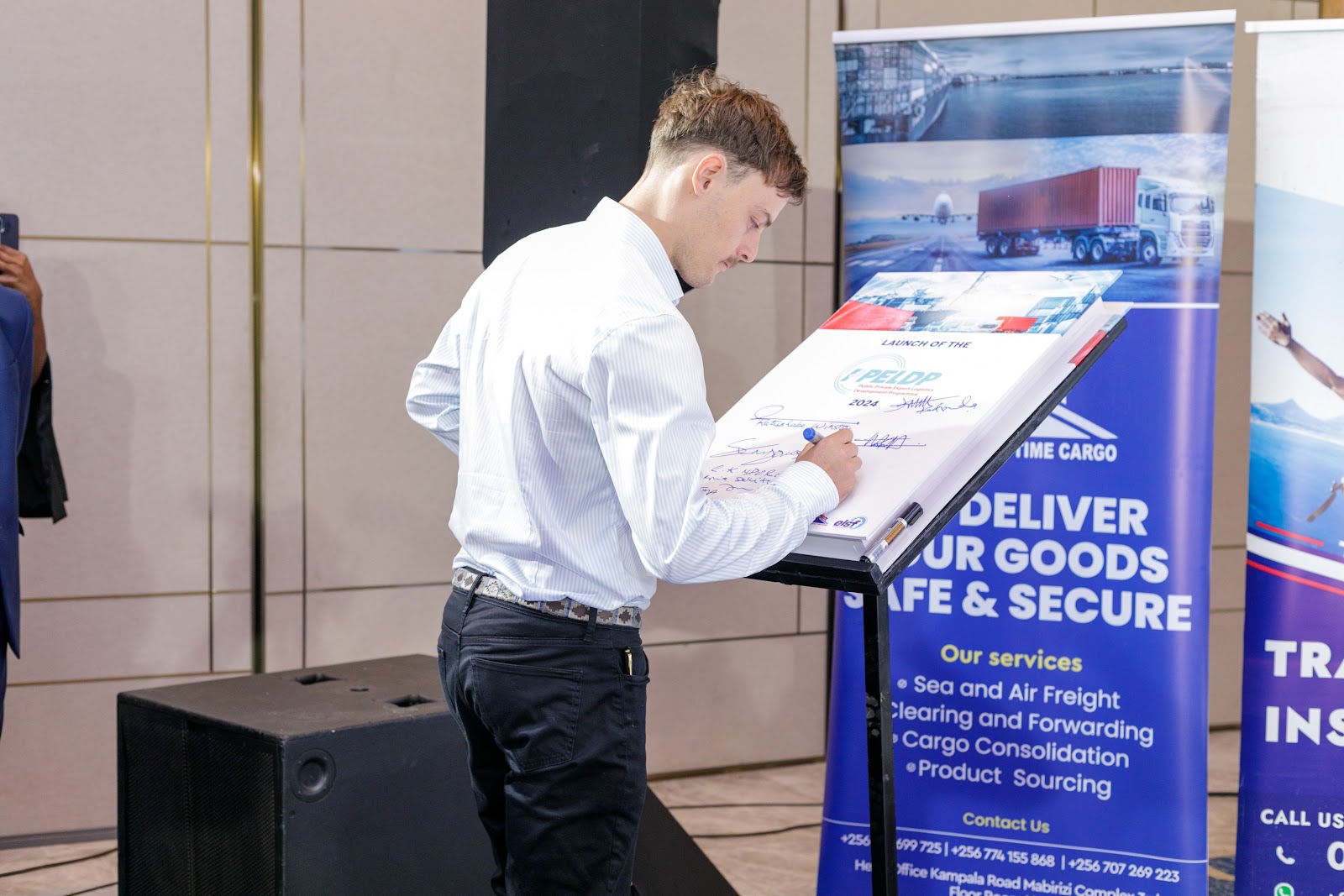 A delegate signing the PPELD commitment