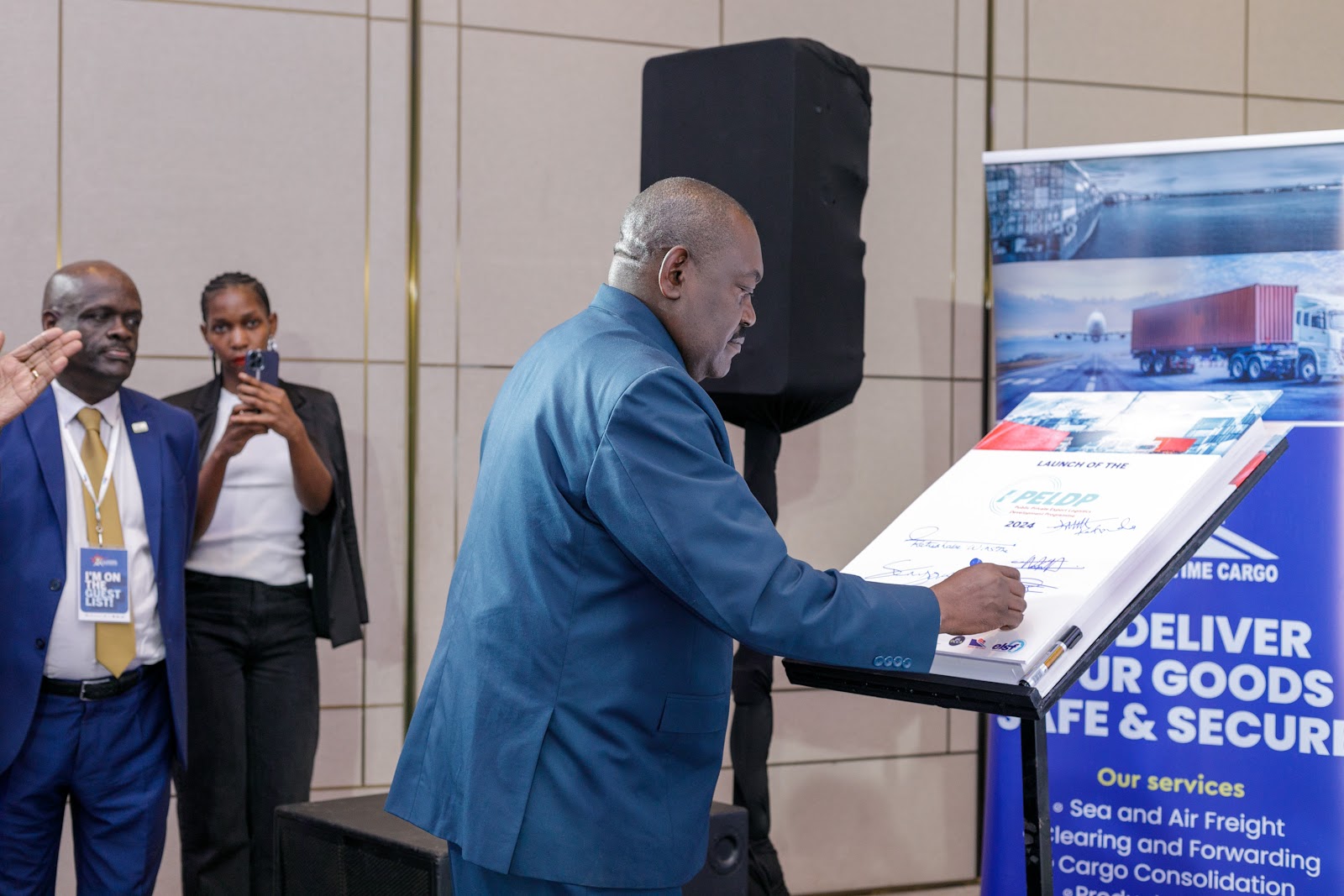 A partner signing the PPELD commitment board
