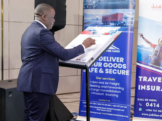 A delegate signing the partnership commitment board